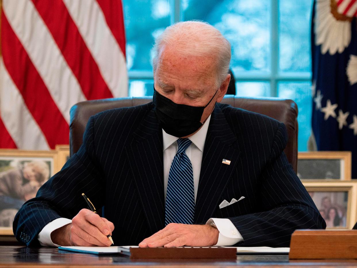 President Joe Biden signs an Executive Order reversing Trump era ban on Transgender serving in the military. (AFP via Getty Images)