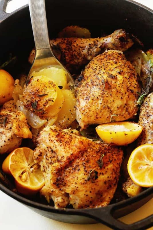 <p>Grandbaby Cakes</p><p>This Lemon Roast Chicken Dinner starts with fresh chicken that is highly seasoned and sprinkled with citrus flavor that’s roasted in delicious juices, onions and potatoes making this the easiest weeknight dinner!!</p><p><strong>Get the recipe: <a href="https://grandbaby-cakes.com/lemon-roasted-chicken/" rel="nofollow noopener" target="_blank" data-ylk="slk:Lemon Roast Chicken Dinner with Potatoes;elm:context_link;itc:0;sec:content-canvas" class="link ">Lemon Roast Chicken Dinner with Potatoes</a></strong></p>