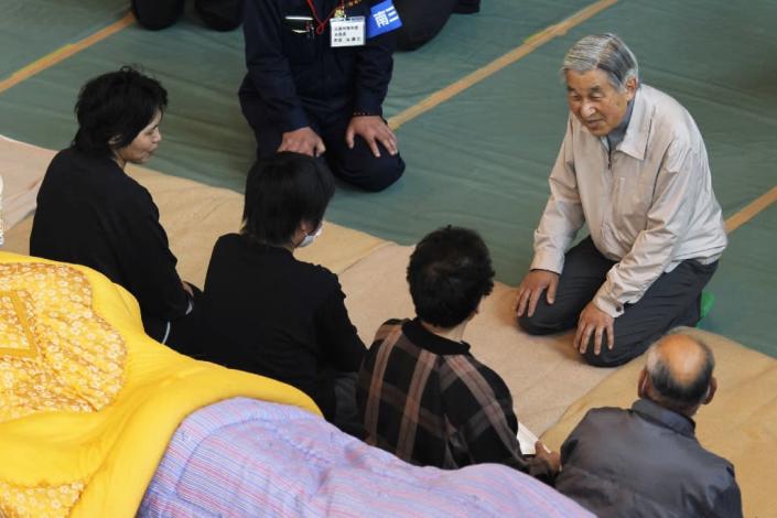 Emperor Akihito and his wife Michiko won plaudits for a popular touch, notably comforting people affected by the 2011 earthquake, tsunami and nuclear meltdown that devastated whole swathes of east Japan and killed thousands (AFP Photo/HIRO KOMAE)