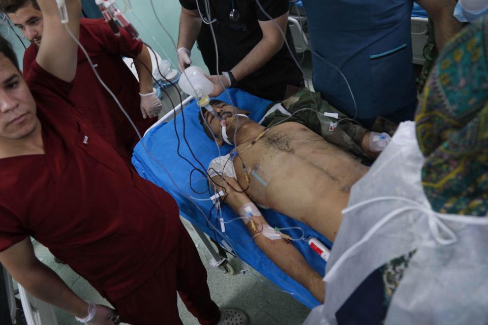 A wounded man is transported to a hospital following an attack on the village of Altun Kupri, south of the regional capital of Erbil in Iraq's semi-autonomous Kurdistan region, September 28, 2022. / Credit: SAFIN HAMED/AFP/Getty