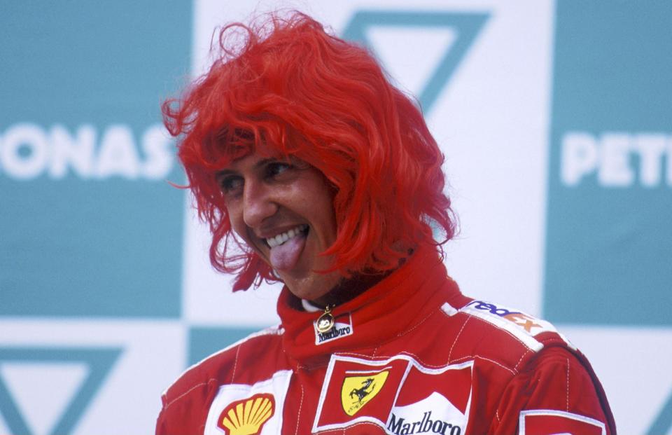 Here wig go: Michael Schumacher lets his hair down with Ferrari at the 2000 Malaysian Grand Prix