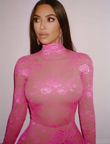 <p>Kim Kardashian Instagram</p> Kim Kardashian Wears Pink Lace Catsuit in Behind-the-Scenes Throwback Photos from SNL