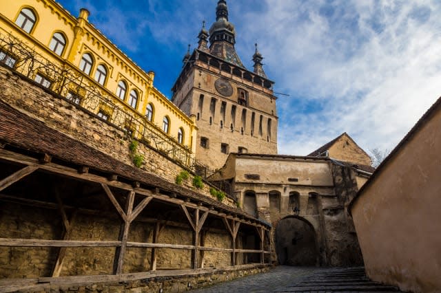 Multi coloured houses and clock tower in Sighisoara old town, Transylvania, Romania