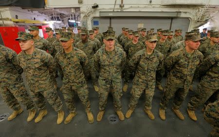 U.S. Marines stand aboard the USS Bonhomme Richard amphibious assault ship during a ceremony marking the start of Talisman Saber 2017, a biennial joint military exercise between the United States and Australia on the the Pacific Ocean off the coast of Sydney, Australia, June 29, 2017. REUTERS/Jason Reed