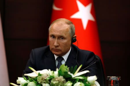 Russian President Putin attends a joint news conference with his counterparts Erdogan of Turkey and Rouhani of Iran in Ankara