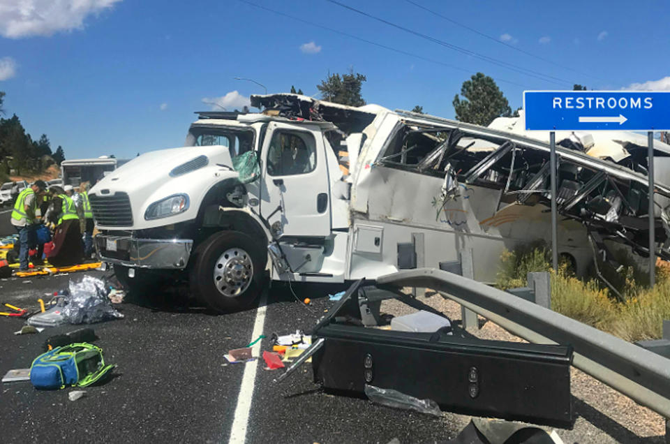 This photo released by the Garfield County Sheriff's Office shows a tour bus that was carrying Chinese-speaking tourists after it crashed near Bryce Canyon National Park in southern Utah, killing at least four people and critically injuring up to 15 others, Friday, Sept. 20, 2019. (Sheriff Danny Perkins/Garfield County Sheriff's Office via AP)