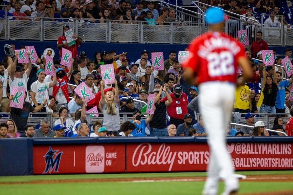 Miami Marlins fans in the ‘Sandy’s Beach’ zone react to pitcher Sandy Alcantara (22) after he got a strike for the final out of the eighth inning of an MLB game against the Los Angeles Dodgers at loanDepot park in the Little Havana neighborhood of Miami, Florida, on Saturday, August 27, 2022. Daniel A. Varela/dvarela@miamiherald.com