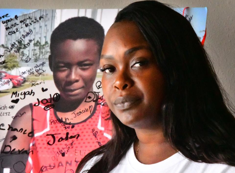 Chrisel Brown talks about her son Jeremiah Khyree Brown,14,  who was shot and killed in The Compound on Christmas last year. Behind her is a poster of her son signed by friends and family on what would have beeen his 15th birthday. 