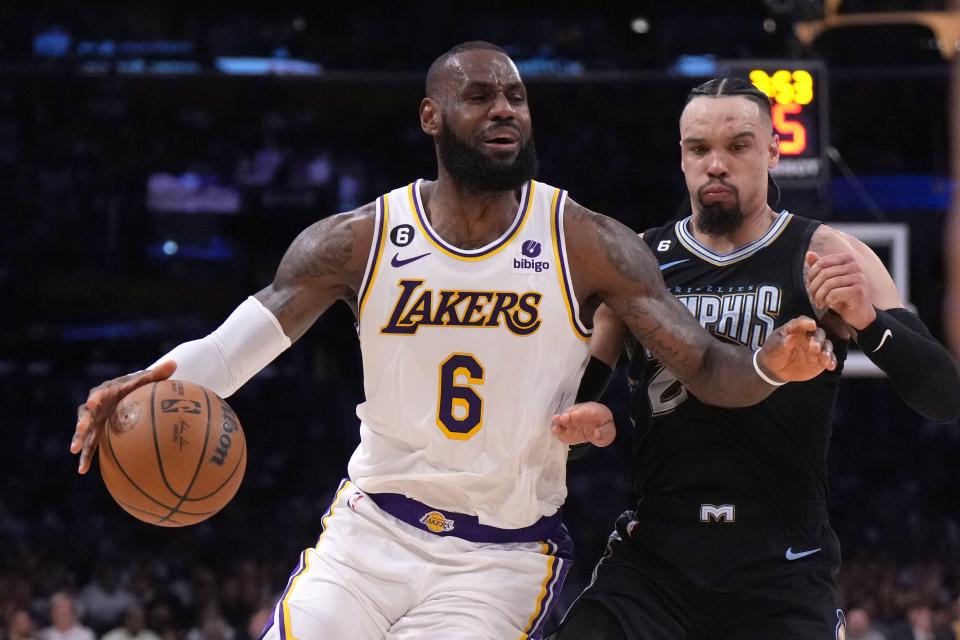 Los Angeles Lakers forward LeBron James (6) dribbles the ball against Memphis Grizzlies forward Dillon Brooks (24) in Game 3 of their NBA playoff series at Crypto.com Arena.