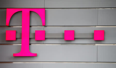 A logo of Germany's telecommunications giant Deutsche Telekom AG is seen before the company's annual news conference in Bonn, Germany, March 2, 2017. REUTERS/Wolfgang Rattay
