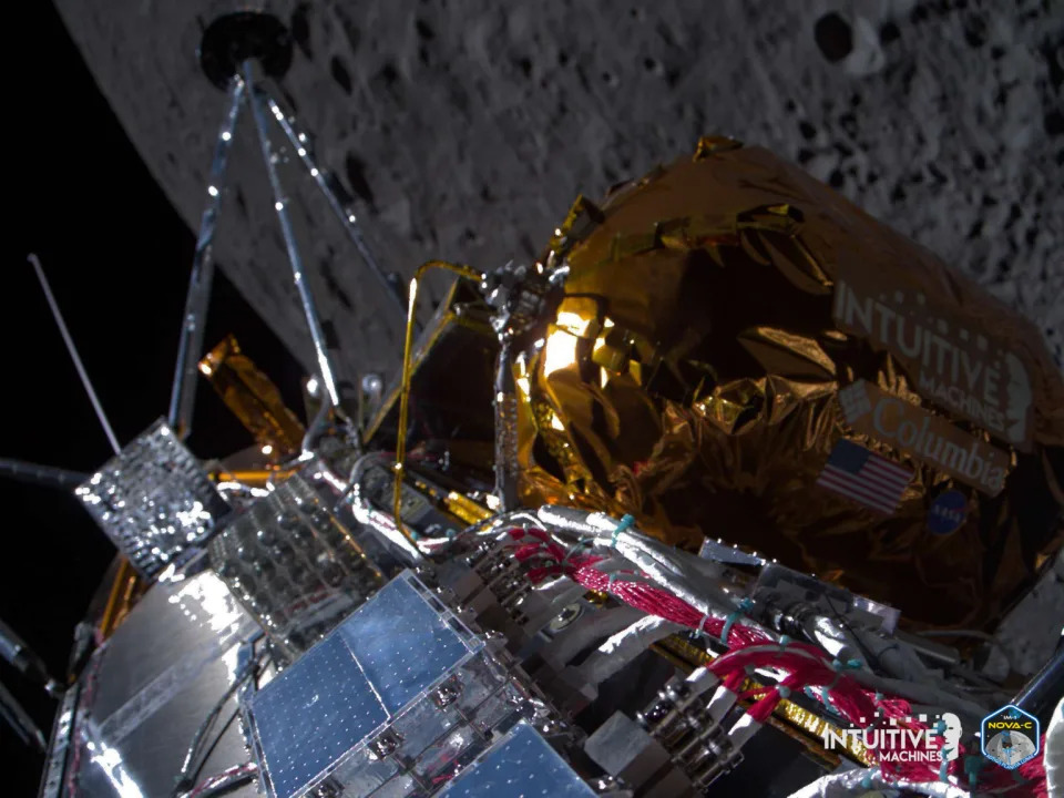 A portion of the Odysseus lander can be seen with the lunar surface in the background from after it reached lunar orbit