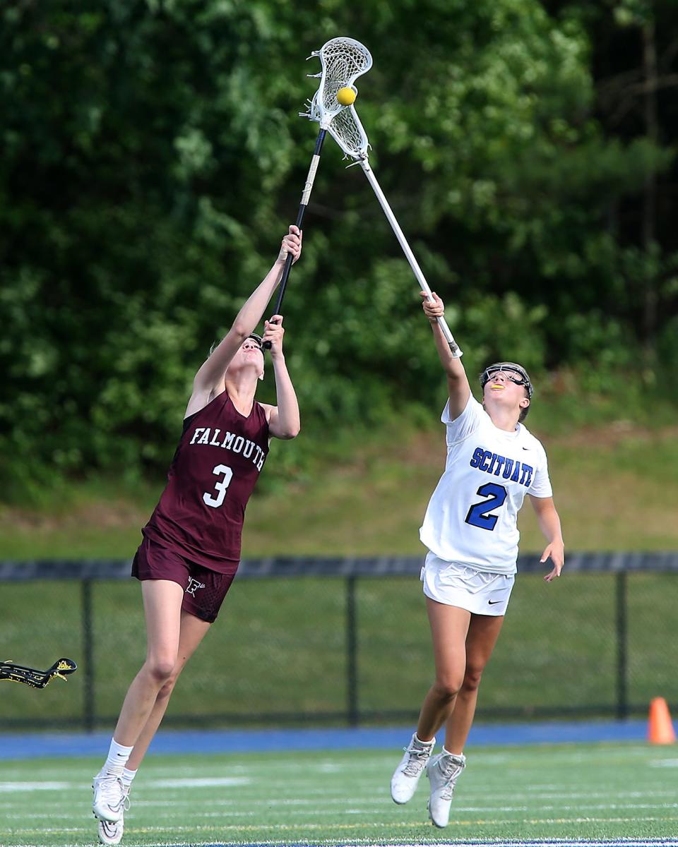 Falmouth's Natalie Bosselman battles Scituate's Katherine Tarsala for the ball on the face off draw during first half action of their game against Scituate in the Round of 32 in the Division 2 state tournament at Scituate High School on Tuesday, June 7, 2022. 