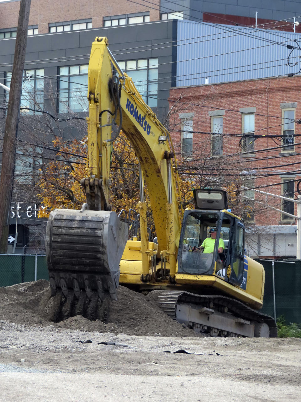 Workers using heavy equipment dig at a site near the Hudson River in Hoboken, N.J., on Wednesday, Oct. 25, 2023, as part of two large flood control projects that began this day that were envisioned in the aftermath of Superstorm Sandy's destruction. (AP Photo/Wayne Parry)