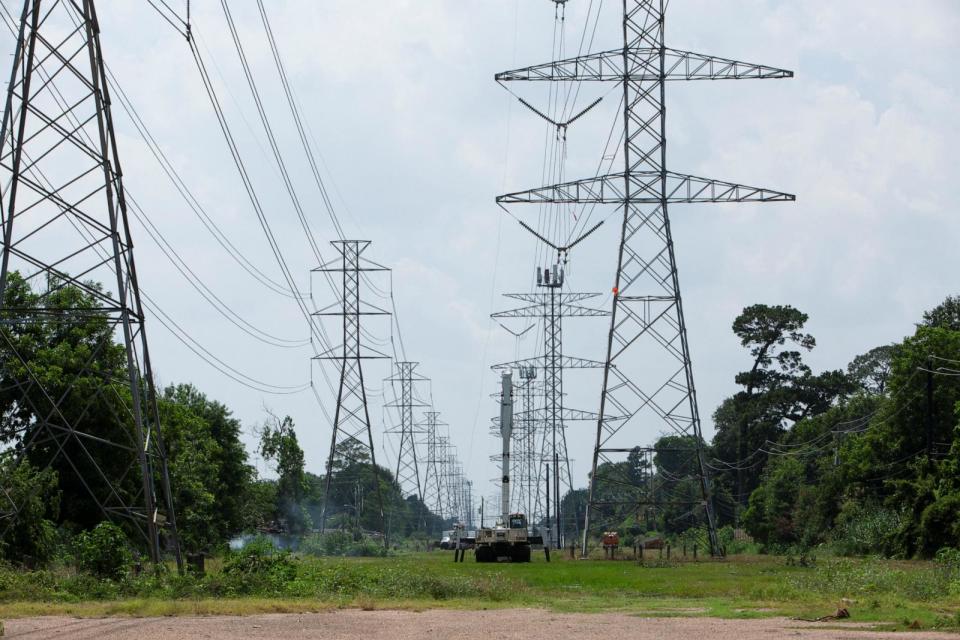 PHOTO: CenterPoint Energy crew members work to repair damaged lines as residents remained without power after a severe storm caused widespread damage in Houston, Texas, May 18, 2024.  (Kaylee Greenlee Beal/Reuters)