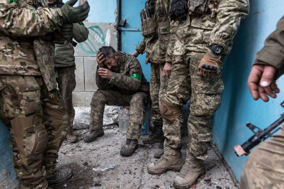 A wounded Ukrainian soldier waits to be transferred to a hospital near the Bakhmut front line in Donetsk Oblast on April 11, 2023. (Diego Herrera Carcedo/Anadolu Agency via Getty Images)