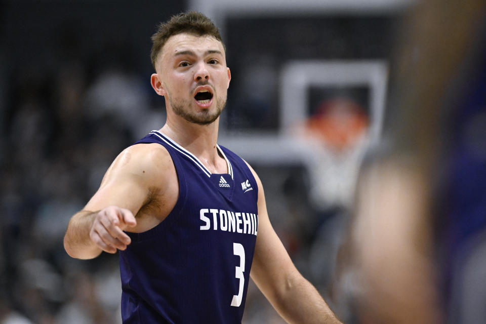 Stonehill's Jackson Benigni calls out to his teammates in the second half of an NCAA college basketball game against UConn, Saturday, Nov. 11, 2023, in Hartford, Conn. (AP Photo/Jessica Hill)