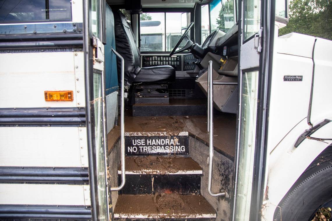 Mud from floodwaters cover the stairs and floors of a bus Thursday, Aug. 19, 2021 at Pisgah High School in Canton after remnants from Tropical Storm Fred caused flooding in parts of Western North Carolina.