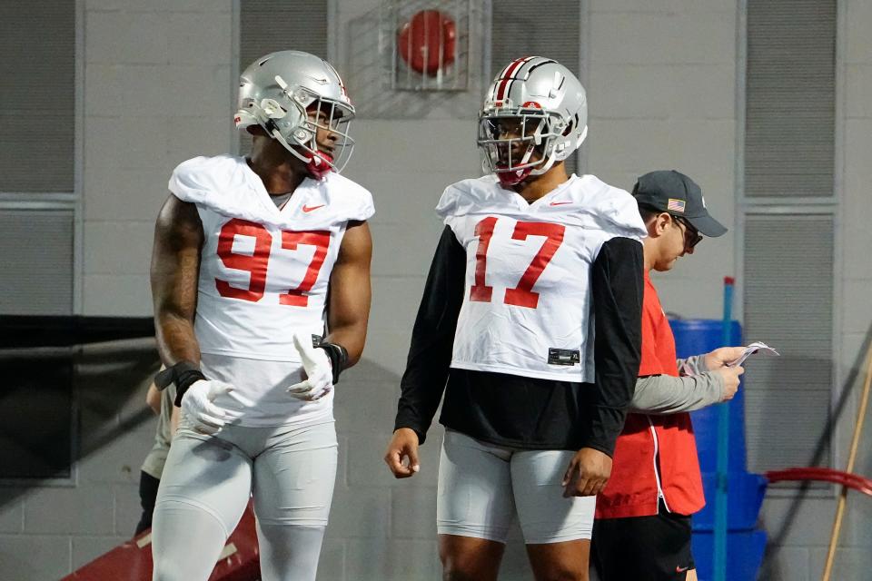 Mar 7, 2023; Columbus, Ohio, USA;  Ohio State Buckeyes linebacker Mitchell Melton (17) talks to defensive end Kenyatta Jackson (97) during spring football drills at the Woody Hayes Athletic Center. Mandatory Credit: Adam Cairns-The Columbus Dispatch