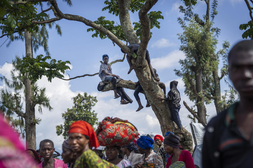 People displaced by the fighting between M23 rebels and FARDC government forces gather North of Goma, Democratic Republic of Congo Friday Nov. 25, 2022. Leaders called for a cease-fire to take effect later this week in eastern Congo following a summit in Angola on Wednesday that included Congo's president and Rwanda's foreign minister but not the M23 rebels whose rapid advance has sharply escalated tensions between the two countries. (AP Photo/Jerome Delay)