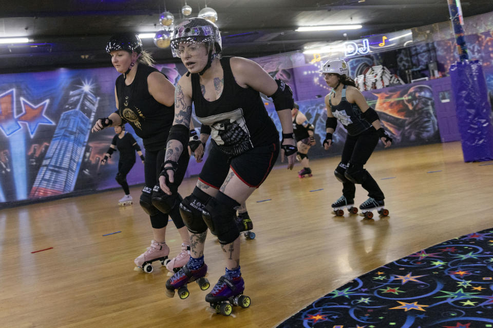 FILE - Members of the Long Island Roller Rebels practice, Mar. 19, 2023, at United Skates of America, in Seaford, NY. The Nassau County legislature, on New York's Long Island, has voted, Monday, June 24, 2024, to bar transgender female athletes from playing on girls' and women's teams at county-owned facilities after a bid to restrict trans athletes by executive order was thrown out in court. (AP Photo/Jeenah Moon, File)