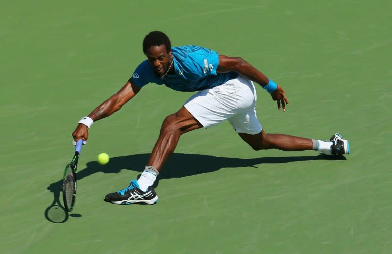 Gael Monfils of France returns a shot to Marcos Baghdatis during their US Open fourth round match on September 4, 2016 in New York