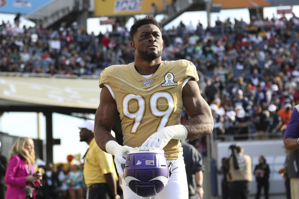 FILE - This is a Sunday, Jan. 26, 2020, file photo showing NFC defensive end Danielle Hunter, of the Minnesota Vikings, walking out onto the field before the second half of the NFL Pro Bowl football game in Orlando, Fla. The Vikings have emerged from their bye week down two starting defensive ends, after a salary-dump trade of Yannick Ngakoue and a season-ending surgery for Danielle Hunter. (AP Photo/Steve Luciano, File)