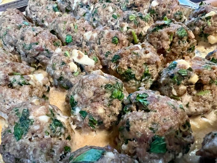 Fresh parsley, lemon zest and feta cheese turn and everyday food like meatballs into something extra special.