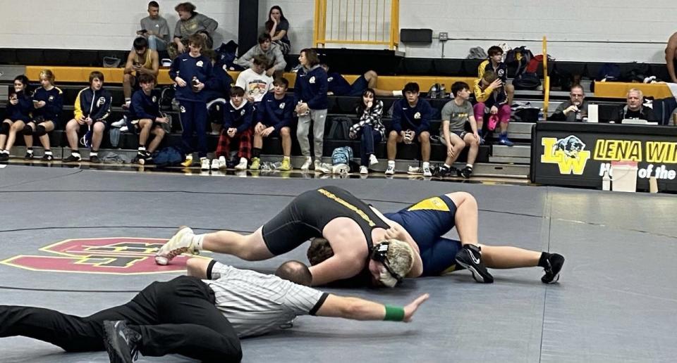 Lena-Winslow/Stockton senior heavyweight Henry Engel, shown putting the finishing touches on his 10-second pin in Lena against Sterling on Dec. 15, 2022, is off to a powerful start to the season.