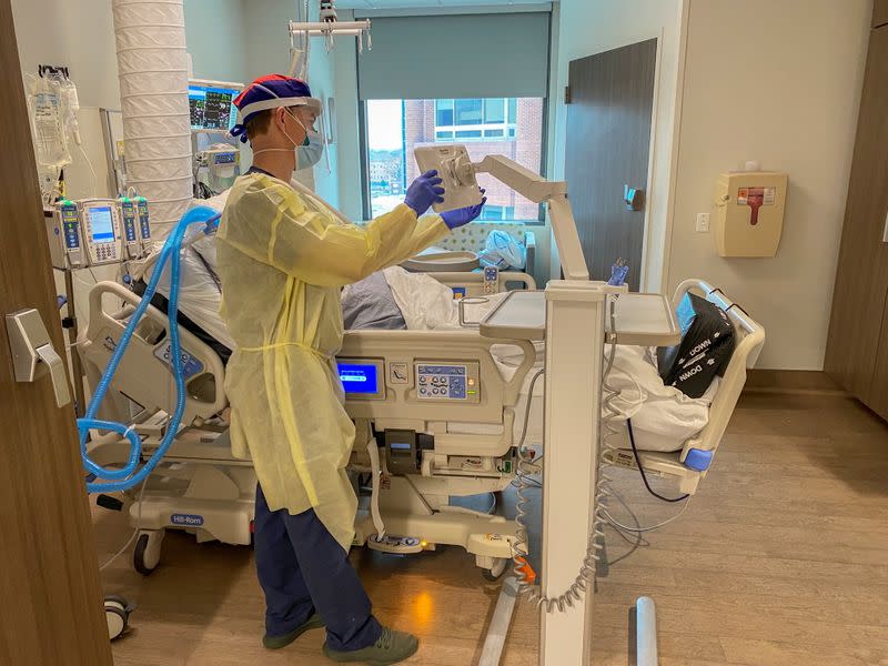 Nurse Matt Robinson, Patient Care Coordinator at the Methodist University Hospital COVID-19 Unit, tends to the coronavirus disease (COVID-19) patients as the hospital prepares for the distribution of the Pfizer vaccine in Memphis