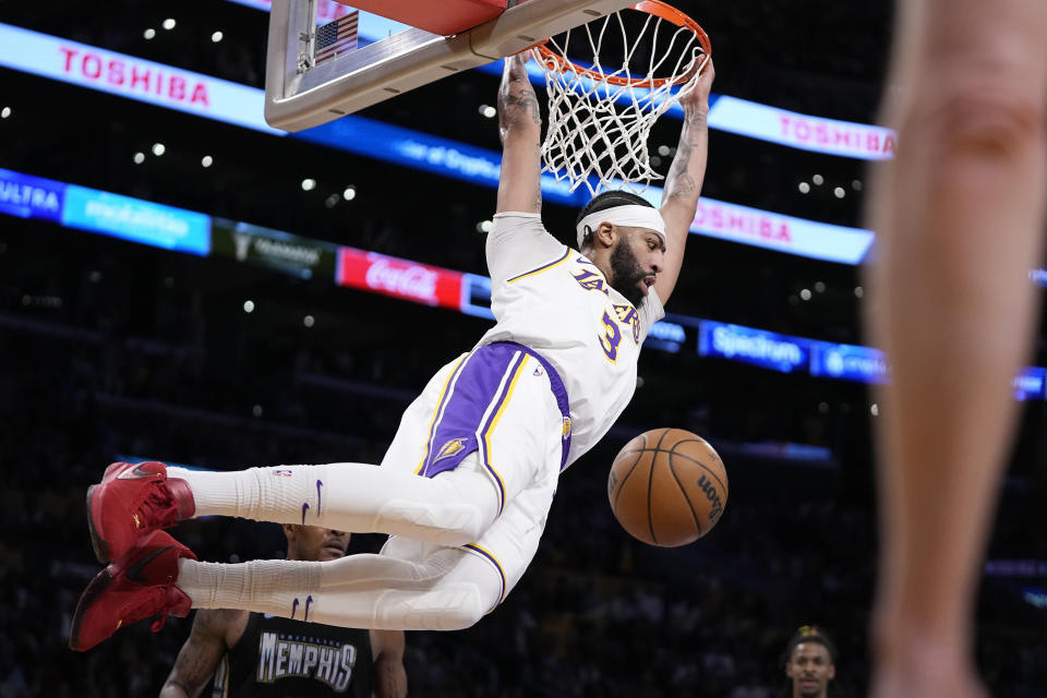 Los Angeles Lakers forward Anthony Davis dunks during the first half in Game 3 of a first-round NBA basketball playoff series against the Memphis Grizzlies Saturday, April 22, 2023, in Los Angeles. (AP Photo/Mark J. Terrill)