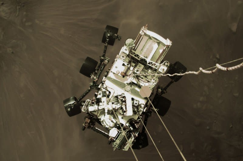 Mars rover Perseverance (pictured while landing on the Red Planet in 2021) already has confirmed an ancient lake on Mars. New research published Friday offers hope that the Perseverance rover's confirmation of that lake could mean sediment samples from the lake's crater might reveal whether life ever existed on Mars. File Photo by NASA/UPI