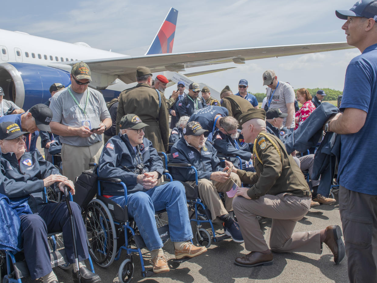 American D-Day veterans are welcomed upon arrival in Deauville, France, on June 3, 2024. (Laetitia Vancon/The New York Times)