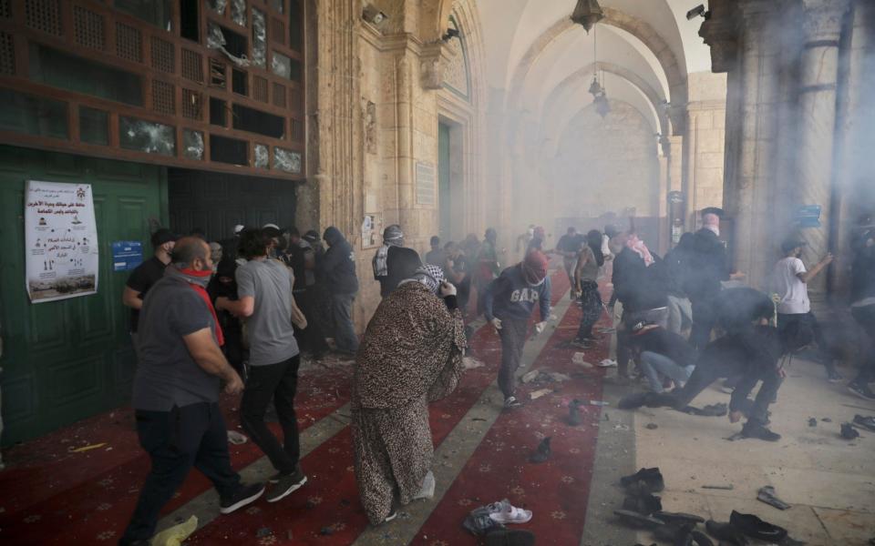 Palestinians clash with Israeli security forces at the Al Aqsa Mosque compound in Jerusalem's Old City Monday, May 10, 2021 - AP/Mahmoud Illean 