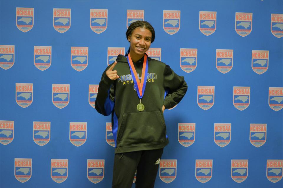 Highland Tech's Lauren Tolbert celebrates a new state record and state gold in the 1,000-meter run at the 2022 NCHSAA Indoor State Championships.