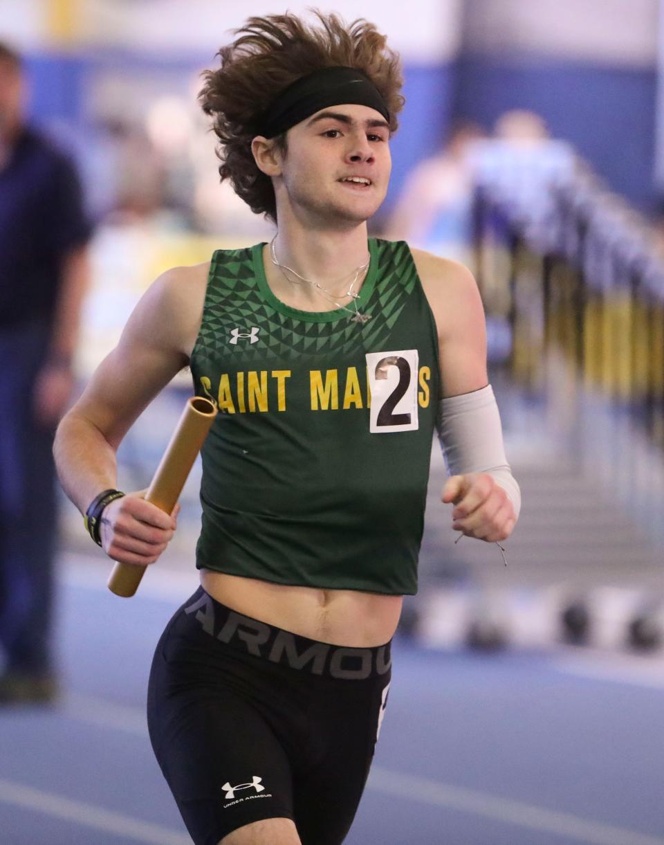 Saint Mark's Brian Yeager takes the baton across the finish line to help his team to a win in the 4x800 meter relay in the DIAA indoor track and field championships at the Prince George's Sports and Learning Complex in Landover, Md., Saturday, Feb. 3, 2024.