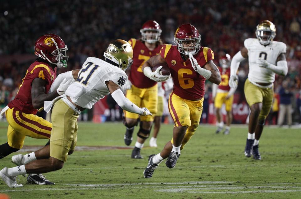 Austin Jones runs with the ball for USC>