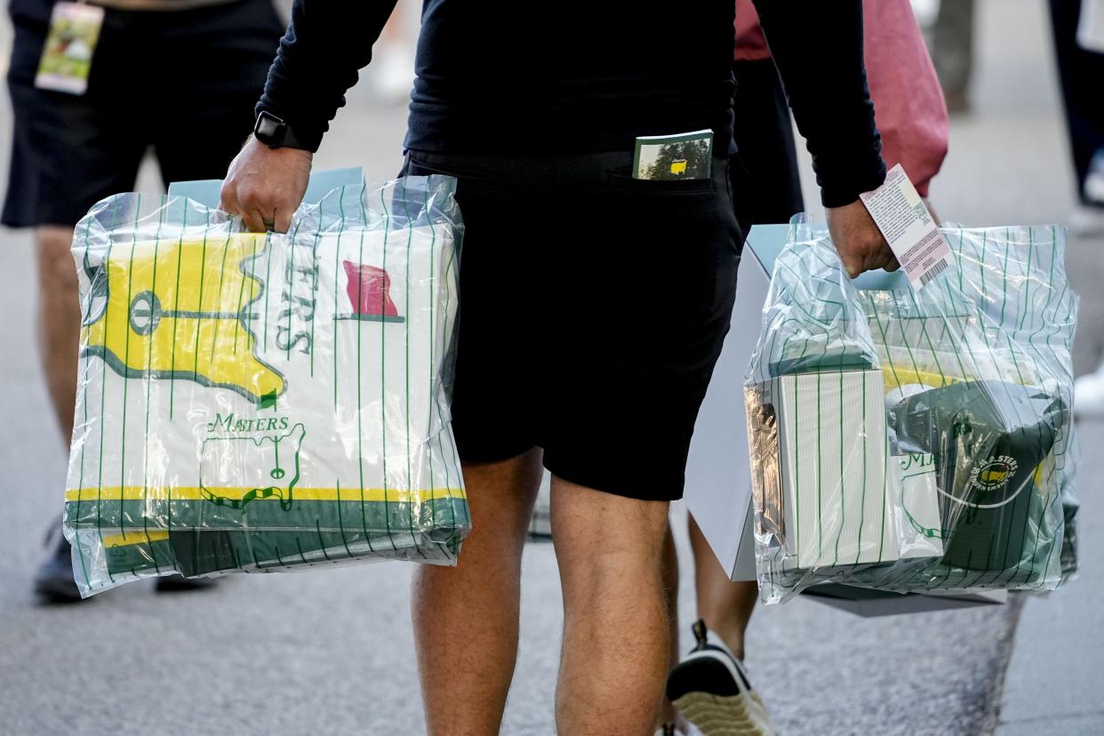 FILE - Apr 8, 2024; Augusta, Georgia, USA; Patrons walk to their cars with purchases from the golf shop during a practice round for the Masters Tournament golf tournament at Augusta National Golf Club. Mandatory Credit: Adam Cairns-USA TODAY Network