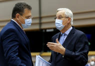 European Commission's Head of Task Force for Relations with the United Kingdom Michel Barnier, right, speaks with European Commissioner for Inter-institutional Relations and Foresight Maros Sefcovic ahead of a report of last weeks EU summit during a plenary session at the European Parliament in Brussels, Wednesday, Oct. 21, 2020. (Olivier Hoslet, Pool via AP)