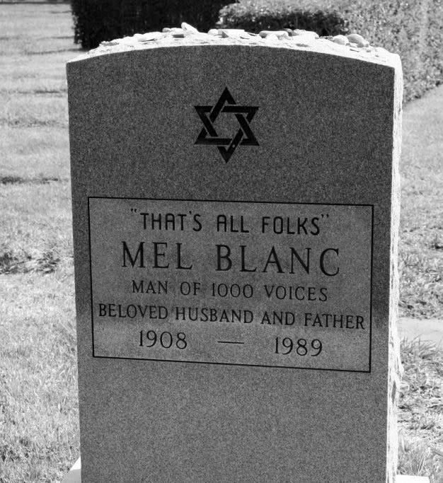 Grave of Blank's tombstone which also features a star of david and says man of 1000 voices, beloved husband and father