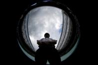 A security guard during a rain delay on Centre Court at the Wimbledon Tennis Championships in London, July 7, 2015. Picture taken with a fish eye lens. (REUTERS/Stefan Wermuth)