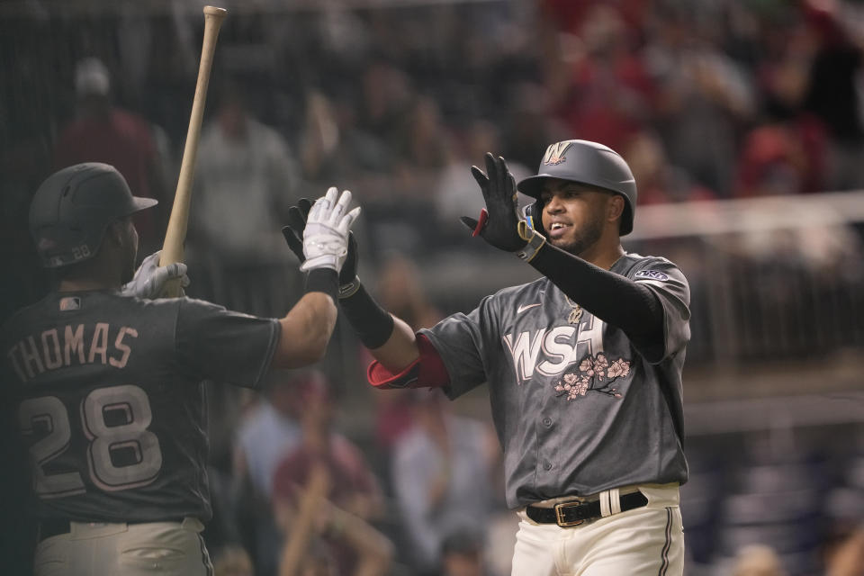 Washington Nationals' Luis Garcia, right, celebrates after his home run during the fourth inning of a baseball game against the Cleveland Guardians in Washington, Friday, April 14, 2023. (AP Photo/Manuel Balce Ceneta)