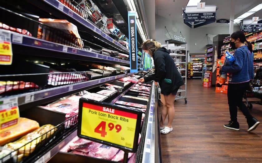 People shop at a grocery store in Monterey Park, California, on April 12, 2022. - Americans paid more for gasoline, food and other essentials last month amid an ongoing wave of record inflation made worse by Russia's invasion of Ukraine, according to government data released Tuesday. (Photo by Frederic J. BROWN / AFP) (Photo by FREDERIC J. BROWN/AFP via Getty Images)