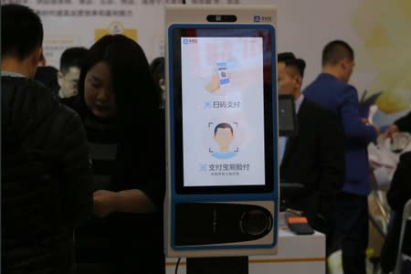 A machine with Alipay's facial recognition payment system is displayed at a smart business fair in Nanjing, Jiangsu