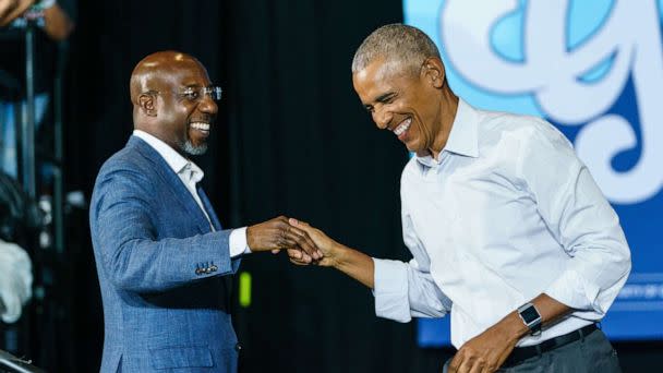 PHOTO: In this Oct. 28, 2022, file photo, former President Barack Obama greets Sen. Raphael Warnock as he arrives at a campaign event for Georgia Democrats on Oct. 28, 2022, in College Park, Ga. (Elijah Nouvelage/Getty Images, FILE)