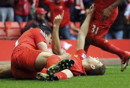 Liverpool's Steven Gerrard, right, celebrates scoring against Manchester United during their English Premier League soccer match at Anfield in Liverpool, England, Sunday Sept. 23, 2012. (AP Photo/Clint Hughes)