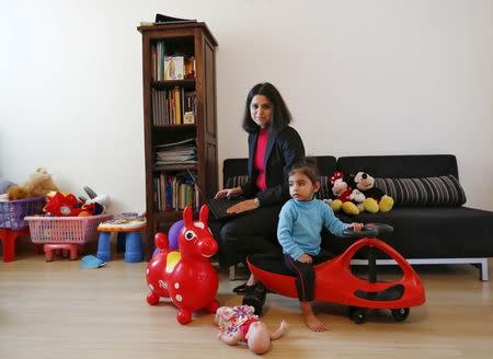 Tanu Anand, 36, an Indian international tax accountant, poses along with her daughter Tanvi, at her residence in Gurgaon on the outskirts of New Delhi, India, November 17, 2015. REUTERS/Anindito Mukherjee