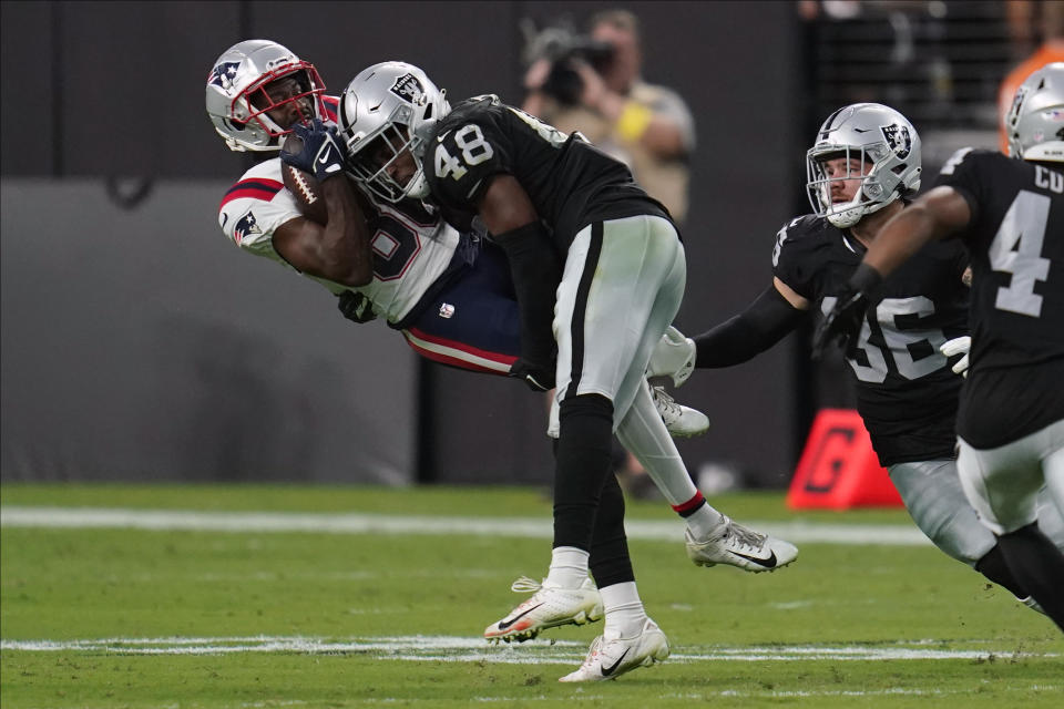 Las Vegas Raiders cornerback Sam Webb (48) tackles New England Patriots wide receiver Josh Hammond (80) during the second half of an NFL preseason football game, Friday, Aug. 26, 2022, in Las Vegas. (AP Photo/Ashley Landis)