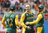 South Africa's AB de Villiers (C) celebrates dismissing Pakistan's Younis Khan with Quinton de Kock (L) and JP Duminy (R) during their Cricket World Cup match in Auckland, March 7, 2015. REUTERS/Nigel Marple
