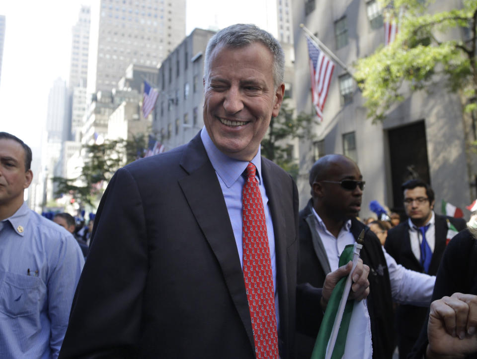 FILE - New York City Mayor Bill de Blasio winks at someone during the Columbus Day Parade in New York, Monday, Oct. 12, 2015. The former New York City Mayor says he will run for Congress in a redrawn district that includes his Brooklyn home. De Blasio announced Friday, May 20, 2022 on MSNBC’s “Morning Joe” that he will seek the Democratic nomination for the 10th Congressional District. (AP Photo/Seth Wenig, File)