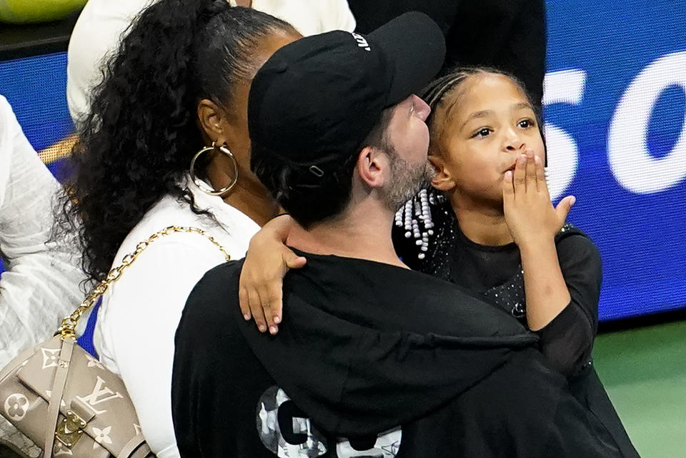 Olympia Ohanian blows a kiss to the crowd while in the arms of her father Alexis Ohanian during the first round of the US Open tennis championships, Monday, Aug. 29, 2022, in New York. (AP Photo/Frank Franklin II)